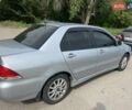 Сірий Міцубісі Lancer, об'ємом двигуна 1.58 л та пробігом 197 тис. км за 3450 $, фото 5 на Automoto.ua