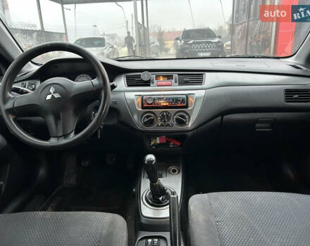 Сірий Міцубісі Lancer, об'ємом двигуна 1.6 л та пробігом 223 тис. км за 3900 $, фото 9 на Automoto.ua
