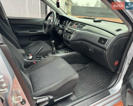 Серый Мицубиси Лансер, объемом двигателя 1.6 л и пробегом 242 тыс. км за 4300 $, фото 13 на Automoto.ua