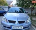 Сірий Міцубісі Lancer, об'ємом двигуна 1.6 л та пробігом 200 тис. км за 3850 $, фото 1 на Automoto.ua