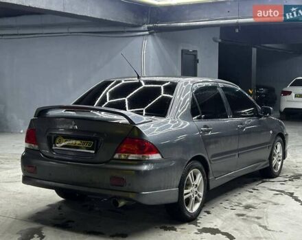 Серый Мицубиси Лансер, объемом двигателя 1.58 л и пробегом 300 тыс. км за 4600 $, фото 5 на Automoto.ua