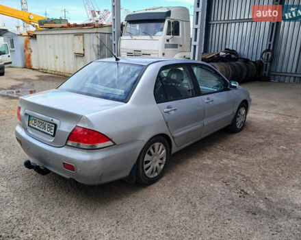 Серый Мицубиси Лансер, объемом двигателя 1.58 л и пробегом 215 тыс. км за 4000 $, фото 3 на Automoto.ua