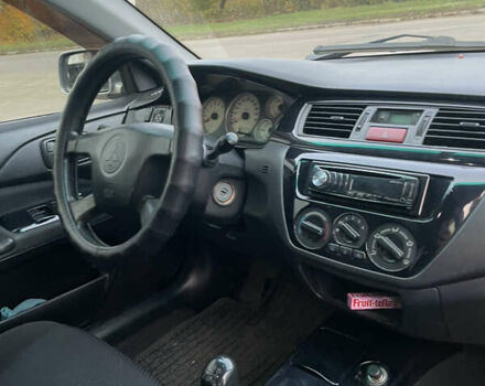 Сірий Міцубісі Lancer, об'ємом двигуна 1.58 л та пробігом 430 тис. км за 2550 $, фото 9 на Automoto.ua