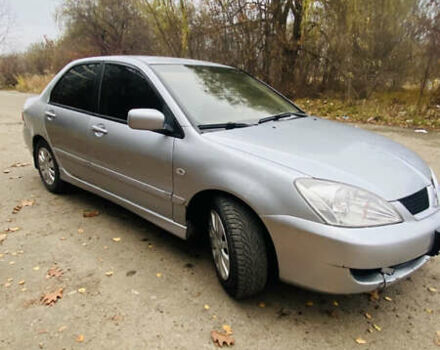 Серый Мицубиси Лансер, объемом двигателя 1.6 л и пробегом 253 тыс. км за 2850 $, фото 2 на Automoto.ua