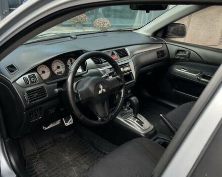 Серый Мицубиси Лансер, объемом двигателя 1.6 л и пробегом 310 тыс. км за 3500 $, фото 5 на Automoto.ua