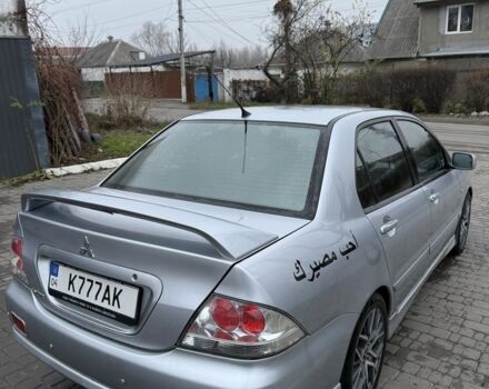 Серый Мицубиси Лансер, объемом двигателя 2 л и пробегом 256 тыс. км за 7000 $, фото 7 на Automoto.ua