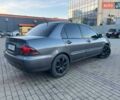 Серый Мицубиси Лансер, объемом двигателя 1.6 л и пробегом 279 тыс. км за 3990 $, фото 4 на Automoto.ua
