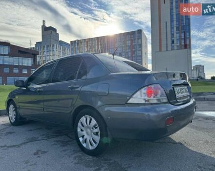 Сірий Міцубісі Lancer, об'ємом двигуна 1.58 л та пробігом 276 тис. км за 3650 $, фото 4 на Automoto.ua