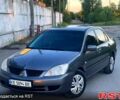 Серый Мицубиси Лансер, объемом двигателя 1.6 л и пробегом 240 тыс. км за 4300 $, фото 1 на Automoto.ua