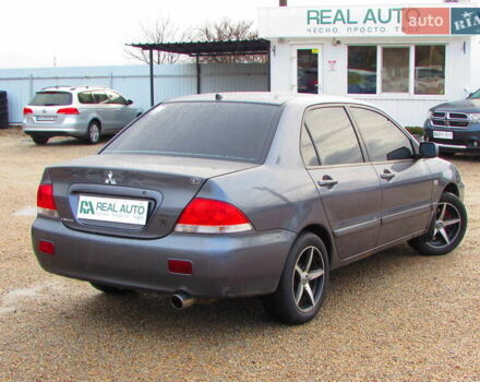 Серый Мицубиси Лансер, объемом двигателя 1.58 л и пробегом 300 тыс. км за 3600 $, фото 2 на Automoto.ua