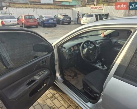 Серый Мицубиси Лансер, объемом двигателя 1.58 л и пробегом 301 тыс. км за 3500 $, фото 6 на Automoto.ua