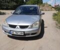 Серый Мицубиси Лансер, объемом двигателя 1.58 л и пробегом 253 тыс. км за 2400 $, фото 1 на Automoto.ua