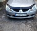 Серый Мицубиси Лансер, объемом двигателя 1.3 л и пробегом 260 тыс. км за 2700 $, фото 1 на Automoto.ua