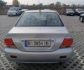 Сірий Міцубісі Lancer, об'ємом двигуна 1.6 л та пробігом 267 тис. км за 3600 $, фото 3 на Automoto.ua