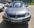 Серый Мицубиси Лансер, объемом двигателя 1.6 л и пробегом 259 тыс. км за 3200 $, фото 1 на Automoto.ua
