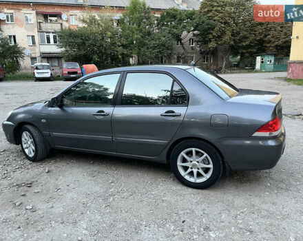 Серый Мицубиси Лансер, объемом двигателя 1.58 л и пробегом 280 тыс. км за 2900 $, фото 12 на Automoto.ua