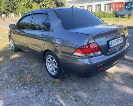 Серый Мицубиси Лансер, объемом двигателя 1.6 л и пробегом 291 тыс. км за 3900 $, фото 1 на Automoto.ua