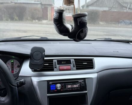 Серый Мицубиси Лансер, объемом двигателя 2 л и пробегом 256 тыс. км за 7000 $, фото 8 на Automoto.ua