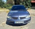 Серый Мицубиси Лансер, объемом двигателя 1.6 л и пробегом 150 тыс. км за 3900 $, фото 1 на Automoto.ua