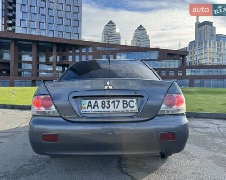 Сірий Міцубісі Lancer, об'ємом двигуна 1.58 л та пробігом 276 тис. км за 3650 $, фото 6 на Automoto.ua