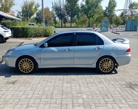 Сірий Міцубісі Lancer, об'ємом двигуна 1.58 л та пробігом 265 тис. км за 2900 $, фото 5 на Automoto.ua