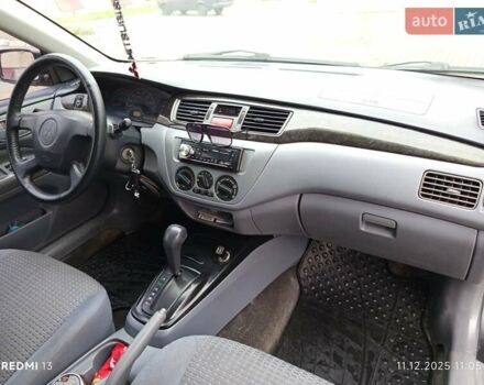 Сірий Міцубісі Lancer, об'ємом двигуна 2 л та пробігом 212 тис. км за 3333 $, фото 6 на Automoto.ua