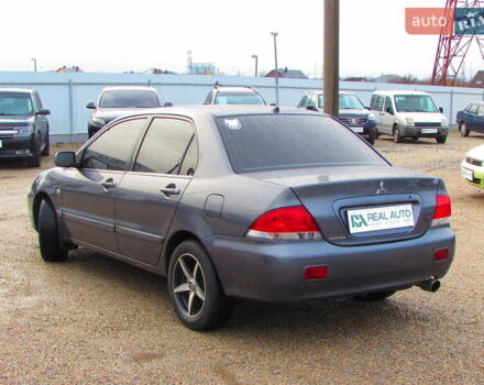 Серый Мицубиси Лансер, объемом двигателя 1.58 л и пробегом 300 тыс. км за 3600 $, фото 1 на Automoto.ua