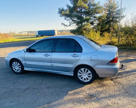 Серый Мицубиси Лансер, объемом двигателя 1.6 л и пробегом 253 тыс. км за 2350 $, фото 3 на Automoto.ua