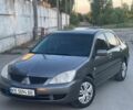 Серый Мицубиси Лансер, объемом двигателя 1.6 л и пробегом 240 тыс. км за 4300 $, фото 1 на Automoto.ua