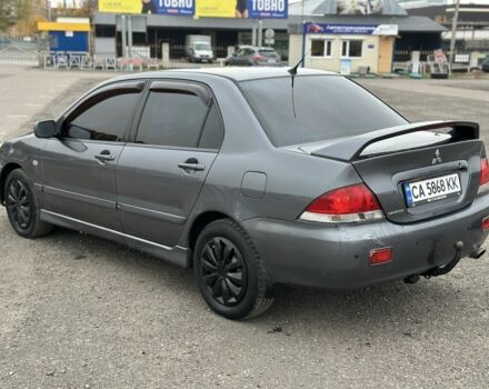 Серый Мицубиси Лансер, объемом двигателя 1.6 л и пробегом 250 тыс. км за 2550 $, фото 5 на Automoto.ua