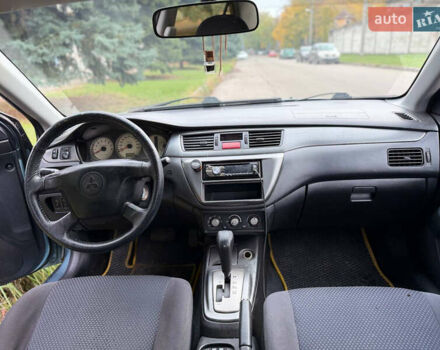 Серый Мицубиси Лансер, объемом двигателя 1.58 л и пробегом 260 тыс. км за 4050 $, фото 7 на Automoto.ua