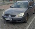 Серый Мицубиси Лансер, объемом двигателя 1.6 л и пробегом 268 тыс. км за 1499 $, фото 1 на Automoto.ua