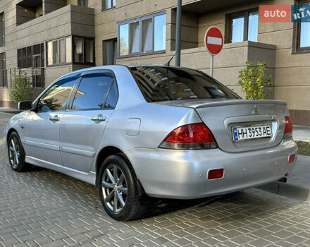 Серый Мицубиси Лансер, объемом двигателя 1.58 л и пробегом 244 тыс. км за 4950 $, фото 7 на Automoto.ua