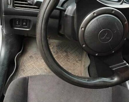 Серый Мицубиси Лансер, объемом двигателя 2 л и пробегом 284 тыс. км за 4100 $, фото 4 на Automoto.ua