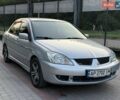 Сірий Міцубісі Lancer, об'ємом двигуна 1.6 л та пробігом 303 тис. км за 4600 $, фото 1 на Automoto.ua