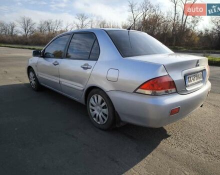 Серый Мицубиси Лансер, объемом двигателя 1.6 л и пробегом 344 тыс. км за 3400 $, фото 2 на Automoto.ua