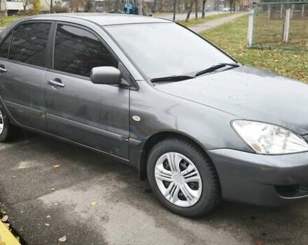 Серый Мицубиси Лансер, объемом двигателя 1.6 л и пробегом 263 тыс. км за 3800 $, фото 6 на Automoto.ua