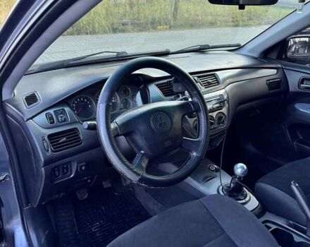 Мицубиси Лансер 2006 в Черновцах на Automoto.ua Серый Мицубиси Лансер, объемом двигателя 1.6 л и пробегом 299 тыс. км за 4300 $, фото 7 на Automoto.ua