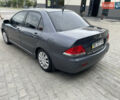 Сірий Міцубісі Lancer, об'ємом двигуна 1.58 л та пробігом 162 тис. км за 4650 $, фото 6 на Automoto.ua