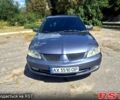 Сірий Міцубісі Lancer, об'ємом двигуна 1.6 л та пробігом 150 тис. км за 3900 $, фото 1 на Automoto.ua