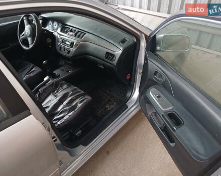 Серый Мицубиси Лансер, объемом двигателя 1.58 л и пробегом 215 тыс. км за 4000 $, фото 7 на Automoto.ua