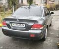 Серый Мицубиси Лансер, объемом двигателя 1.6 л и пробегом 263 тыс. км за 3800 $, фото 4 на Automoto.ua
