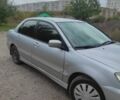 Серый Мицубиси Лансер, объемом двигателя 1.6 л и пробегом 209 тыс. км за 3500 $, фото 1 на Automoto.ua