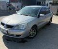 Сірий Міцубісі Lancer, об'ємом двигуна 1.58 л та пробігом 307 тис. км за 2500 $, фото 1 на Automoto.ua