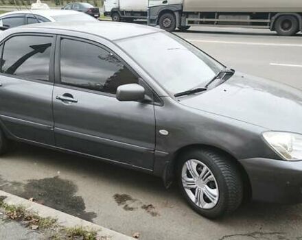 Серый Мицубиси Лансер, объемом двигателя 1.6 л и пробегом 263 тыс. км за 3650 $, фото 3 на Automoto.ua