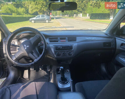 Серый Мицубиси Лансер, объемом двигателя 1.6 л и пробегом 291 тыс. км за 3900 $, фото 5 на Automoto.ua