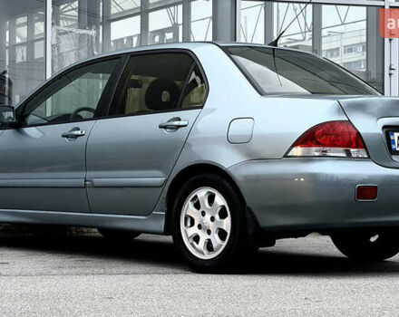 Сірий Міцубісі Lancer, об'ємом двигуна 1.58 л та пробігом 275 тис. км за 4600 $, фото 2 на Automoto.ua