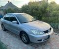 Сірий Міцубісі Lancer, об'ємом двигуна 1.6 л та пробігом 296 тис. км за 3550 $, фото 1 на Automoto.ua