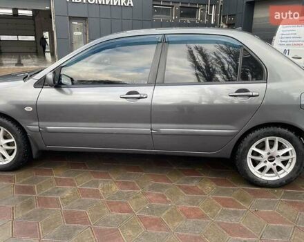 Сірий Міцубісі Lancer, об'ємом двигуна 1.6 л та пробігом 262 тис. км за 4400 $, фото 7 на Automoto.ua