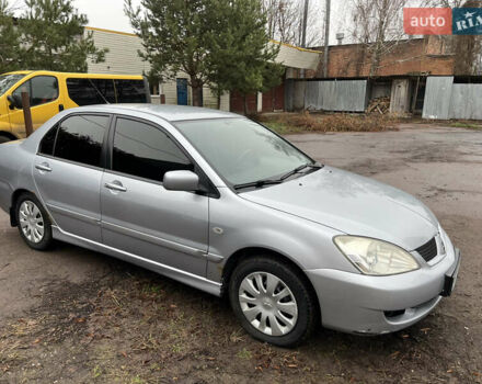 Сірий Міцубісі Lancer, об'ємом двигуна 1.58 л та пробігом 308 тис. км за 3700 $, фото 8 на Automoto.ua